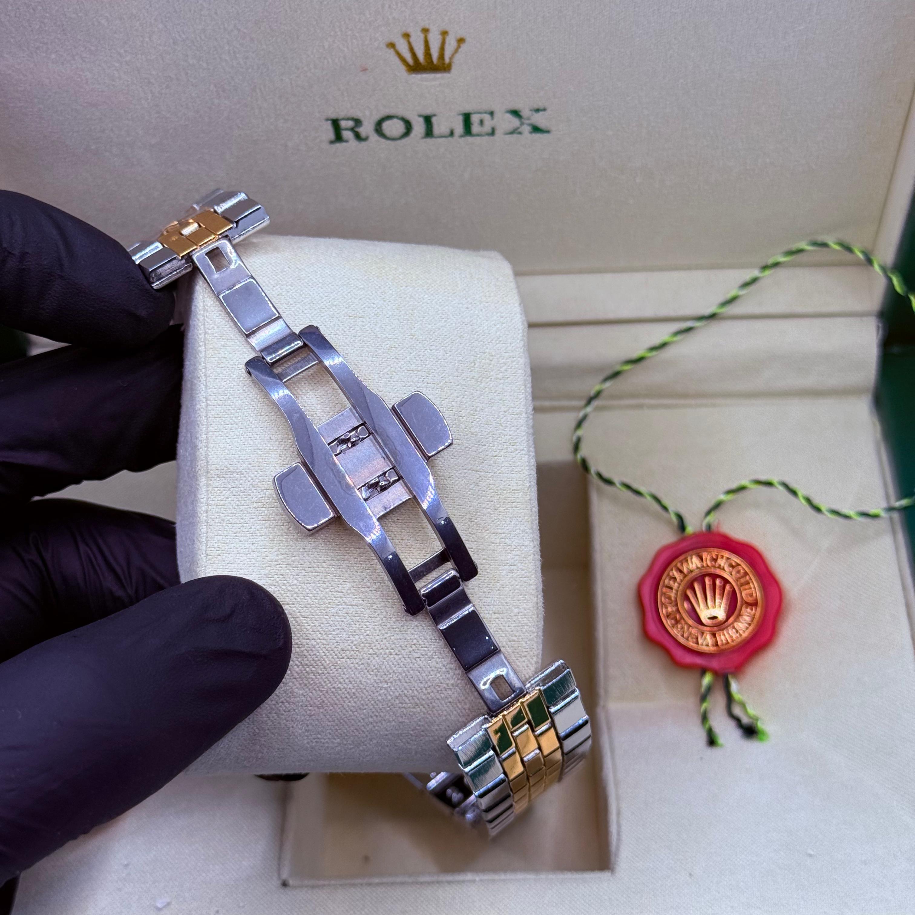 Rolex land dweller truetone with green dial